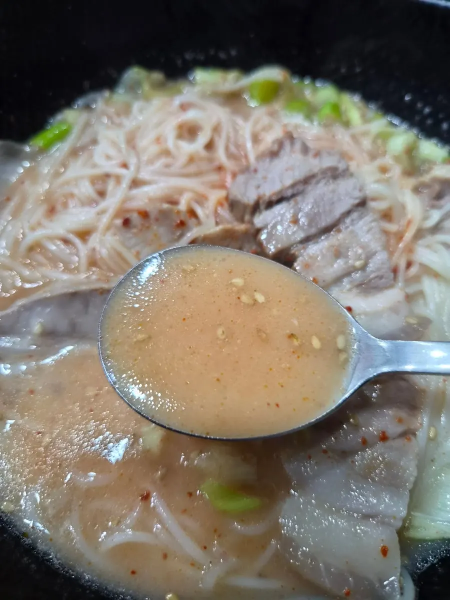 Jeju pork noodle soup with milky broth