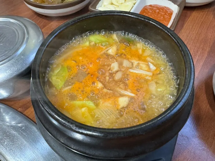 Doenjang jjigae served alongside the grilled meat