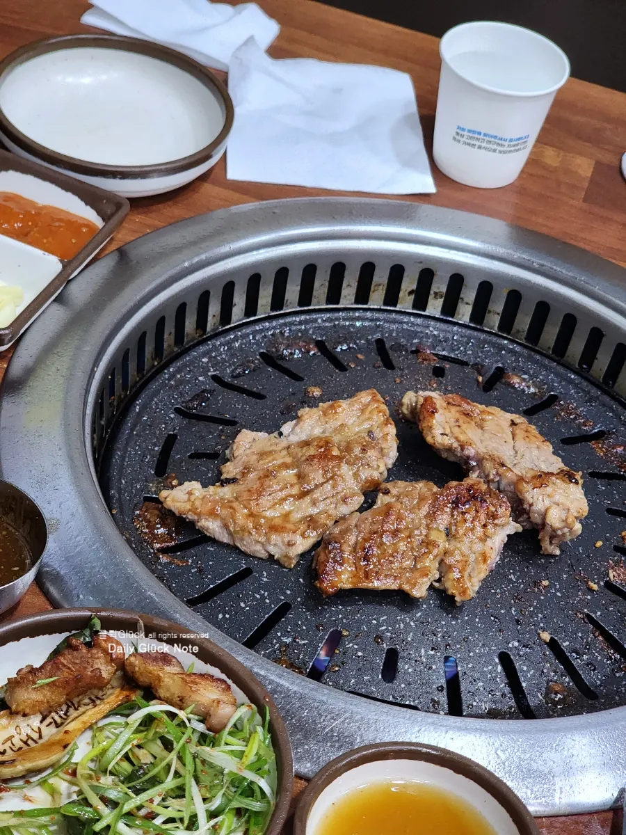 A piece of black pork belly dipped in myeoljeot