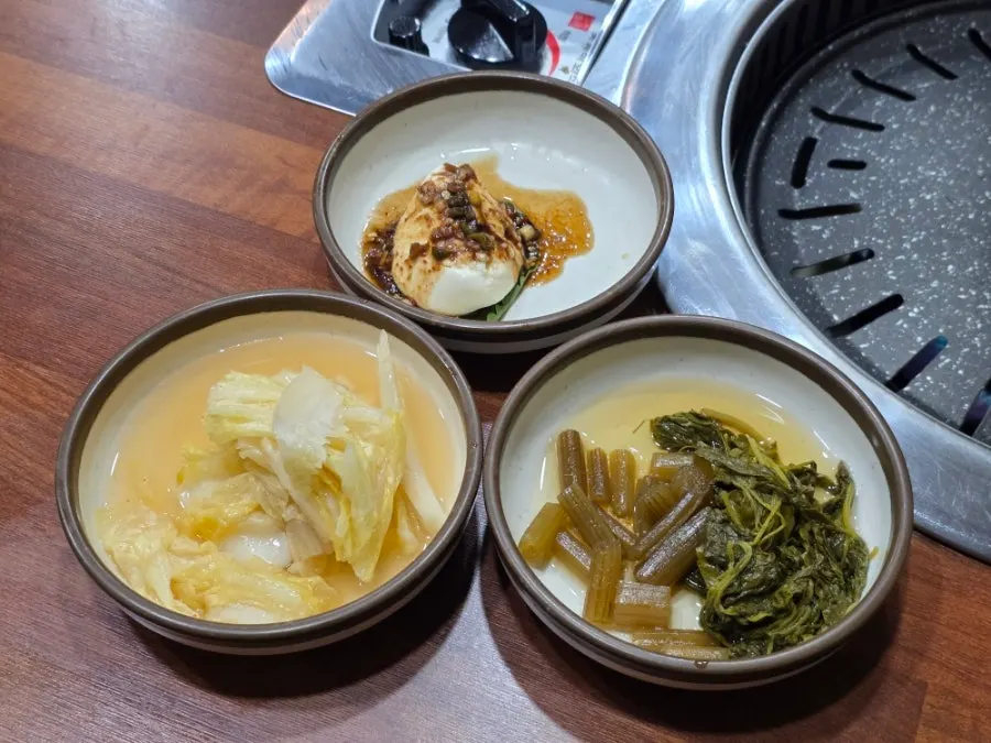 A tray full of banchan (side dishes)