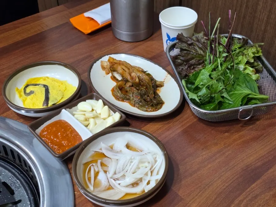 Soft tofu and white kimchi banchan spread