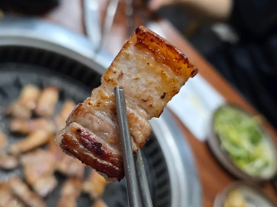 A piece of pork belly dipped in myeoljeot