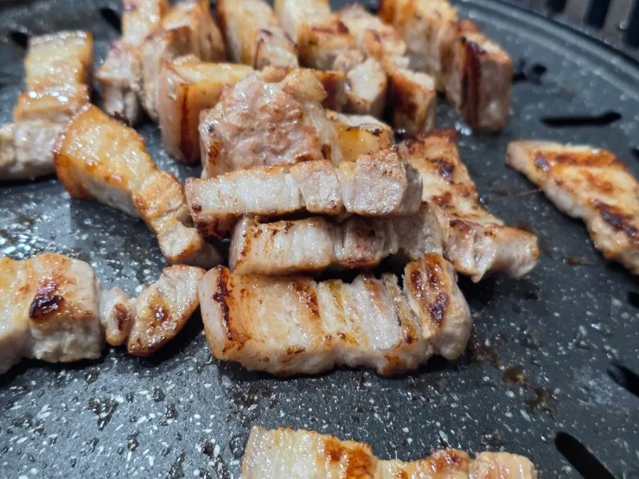A wrap topped with grilled bracken and kimchi