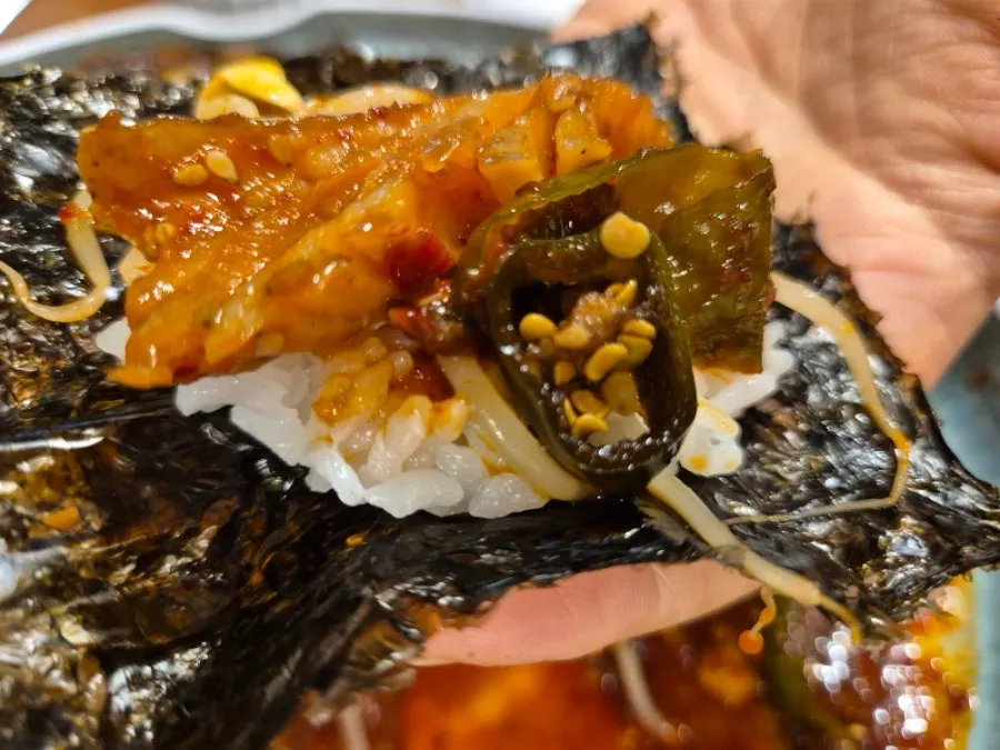 Spicy braised pollock coated in red sauce