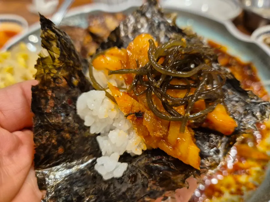 Tender pollock meat pulled apart with chopsticks