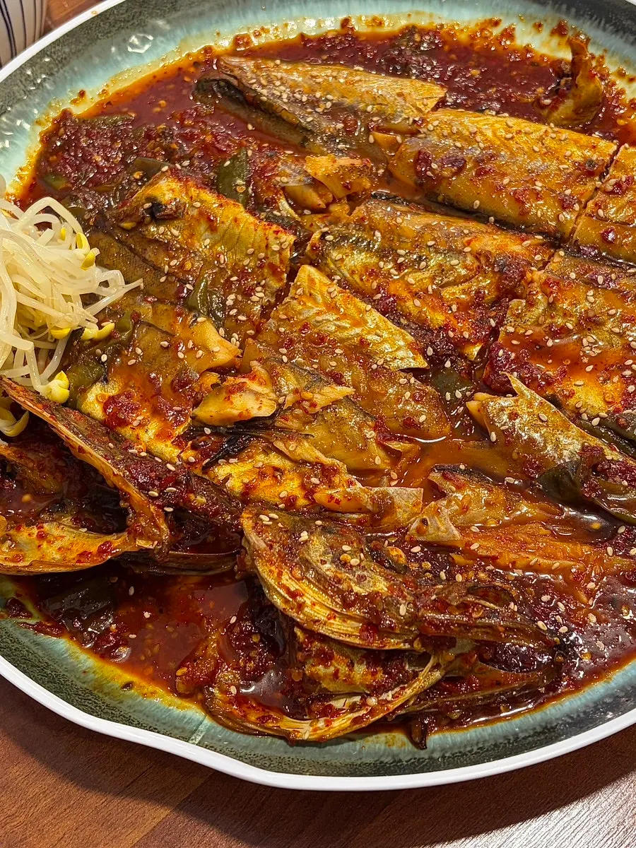 Close-up of braised pollock loaded with sauce