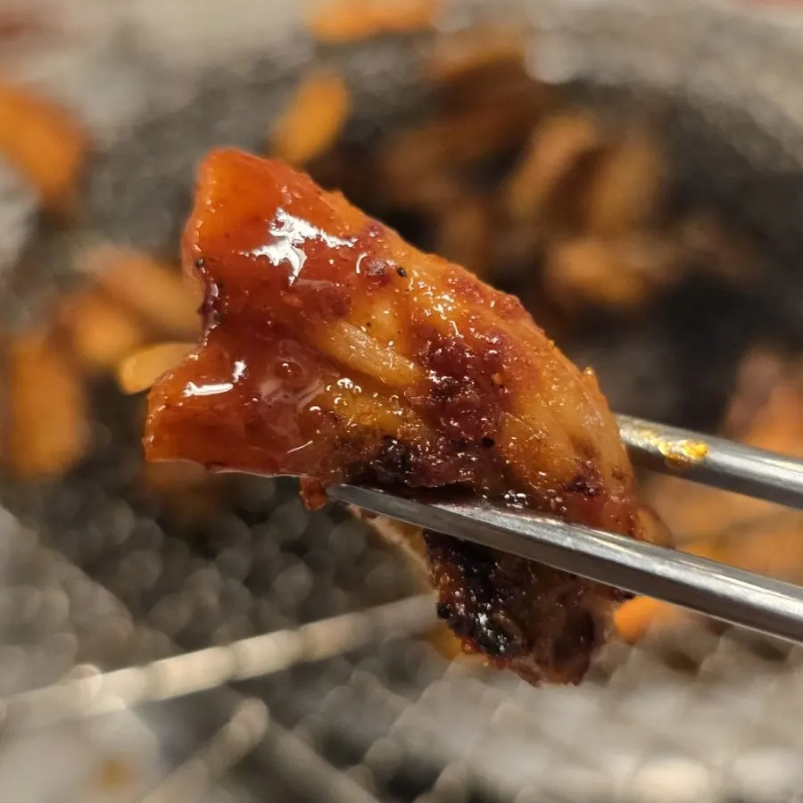 Sauced kkomjangeo grilled with sauce soaked in