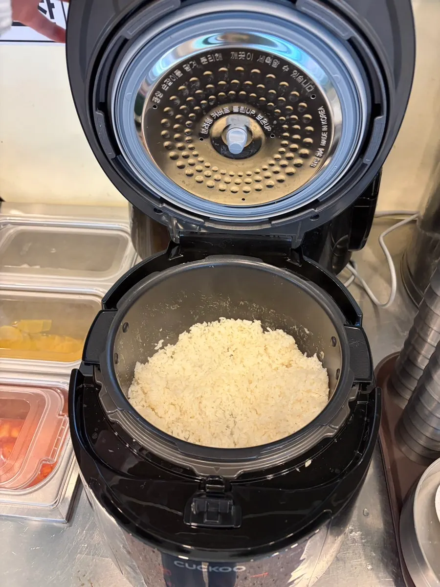 Warm broth and rice available at the self-serve bar