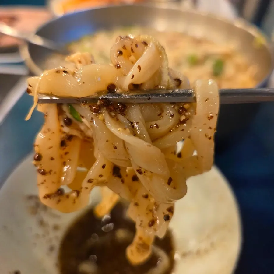 Kalguksu noodles dipped in perilla oil sauce