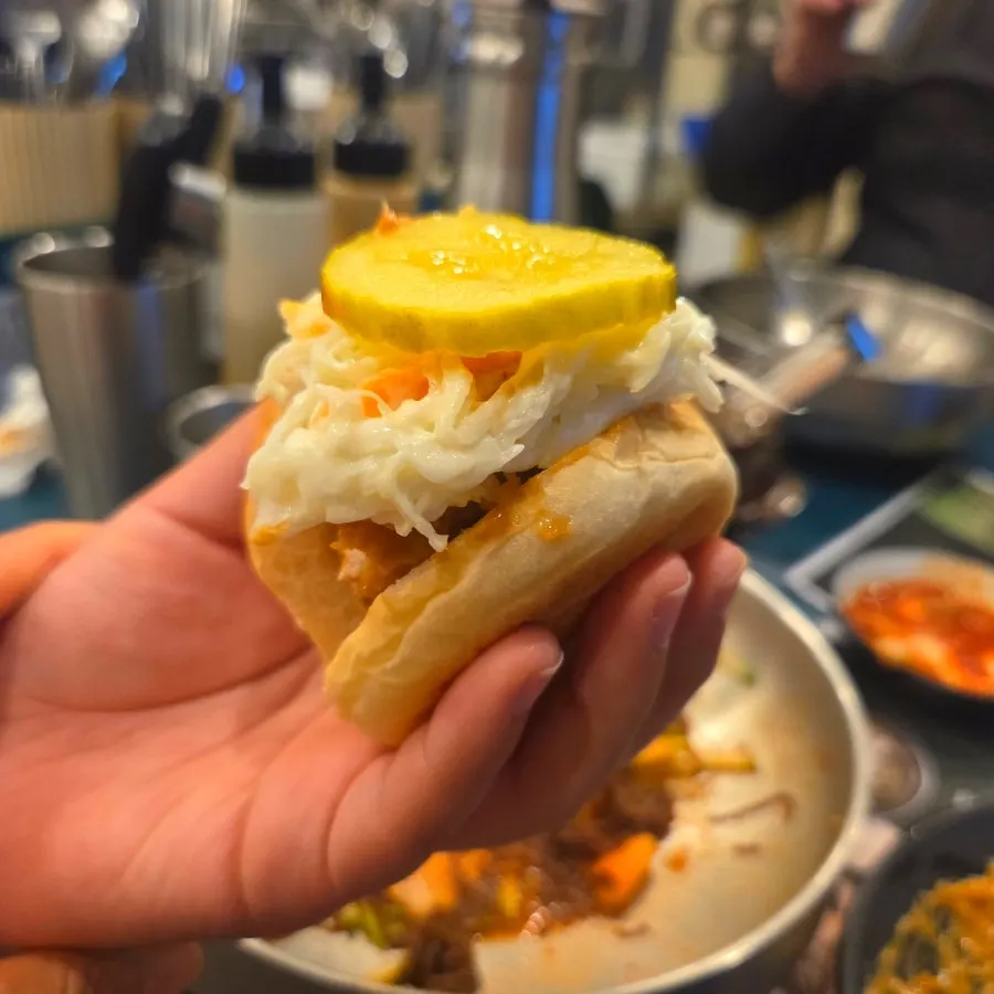 Mini sandwich made with dinner roll, katsu, and salad
