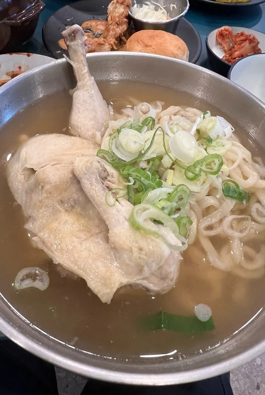 Myeongyeok's chicken kalguksu with half a chicken inside