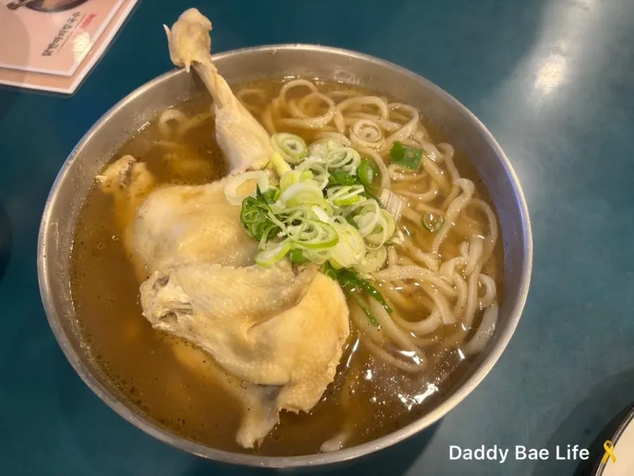 Half-chicken kalguksu topped with chicken