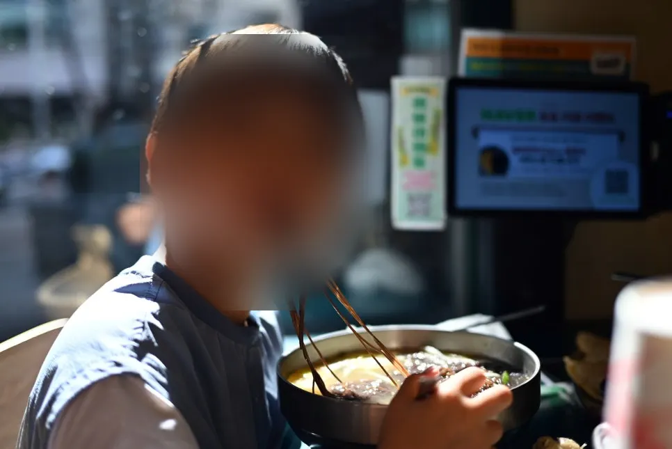 Two bowls of mul-naengmyeon at Myeongyeok