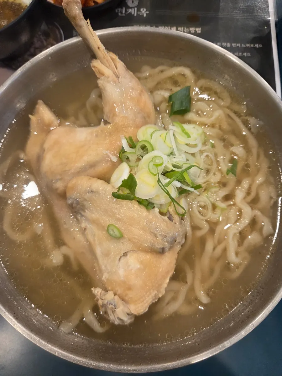 Myeongyeok's chicken kalguksu with half a chicken inside