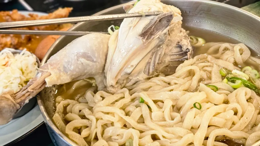 Broth and noodles from the half-chicken kalguksu