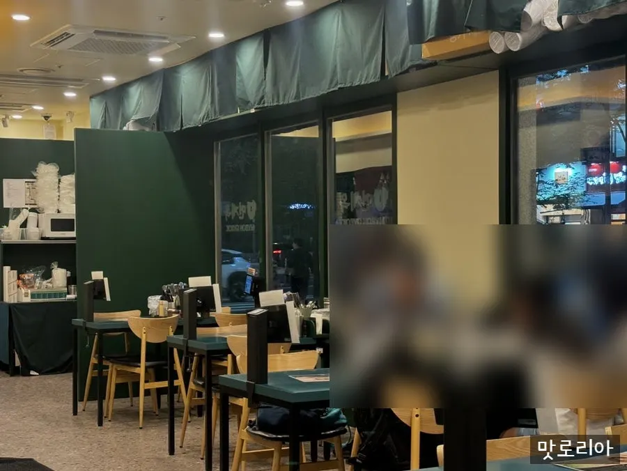 Fully seated interior of Myeongyeok on a weekend evening