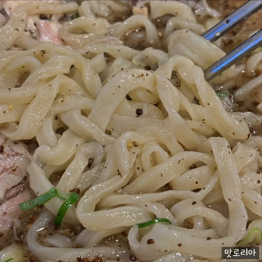 Well-cooked kalguksu noodles lifted from the bowl