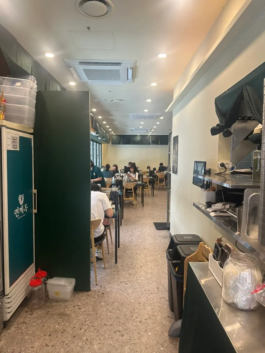 Interior tables and seating at Myeongyeok Bundang Sunae