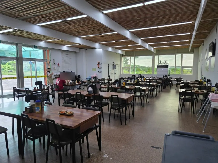 Spacious interior of Myeonjumak Jeju Main Branch with tables set well apart