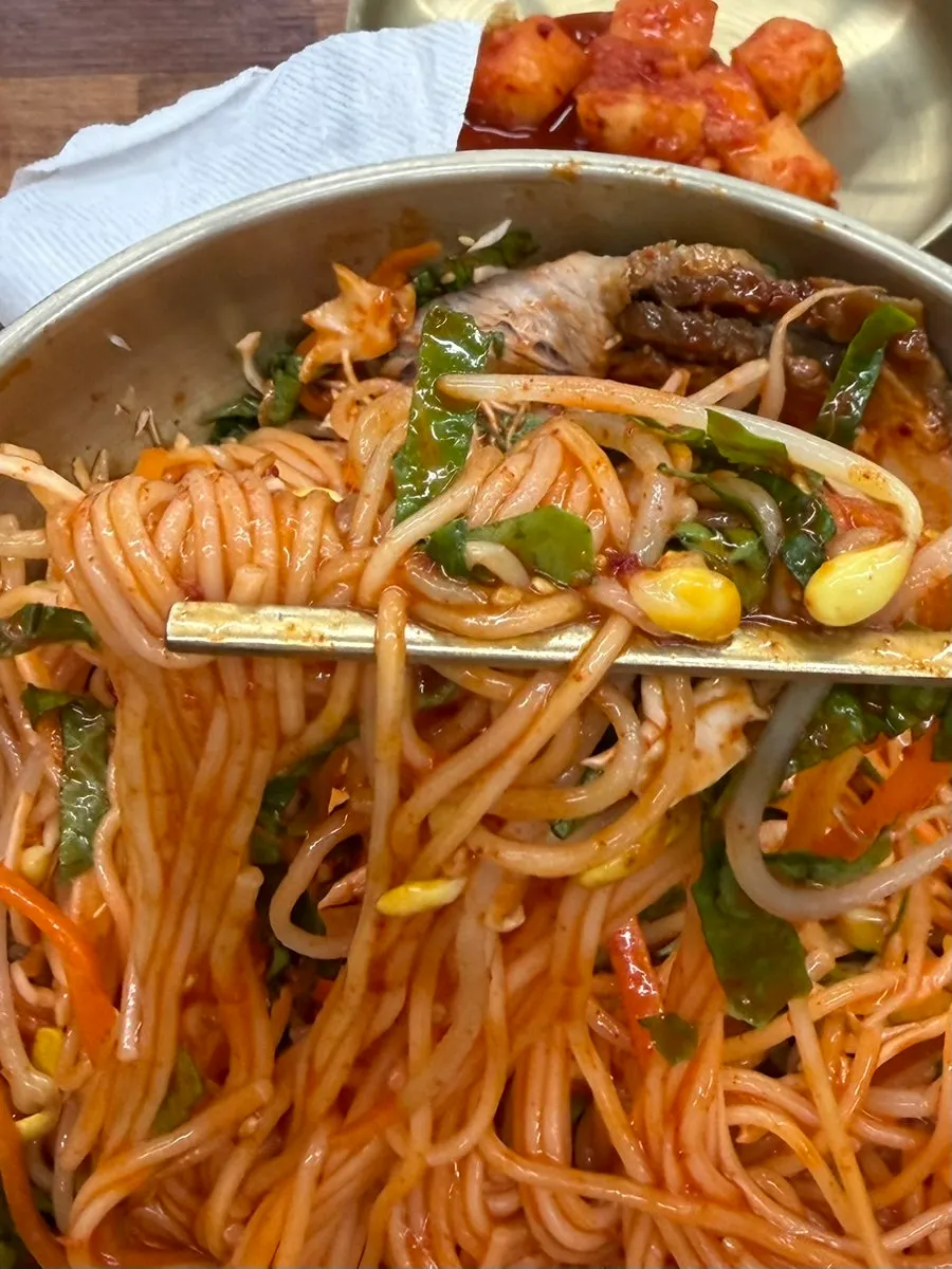Meat bibim guksu mixed with seasoning