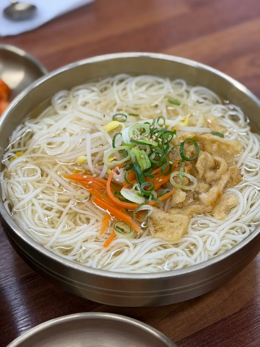 Myeonjumak's anchovy guksu topped with fried tofu and green onion