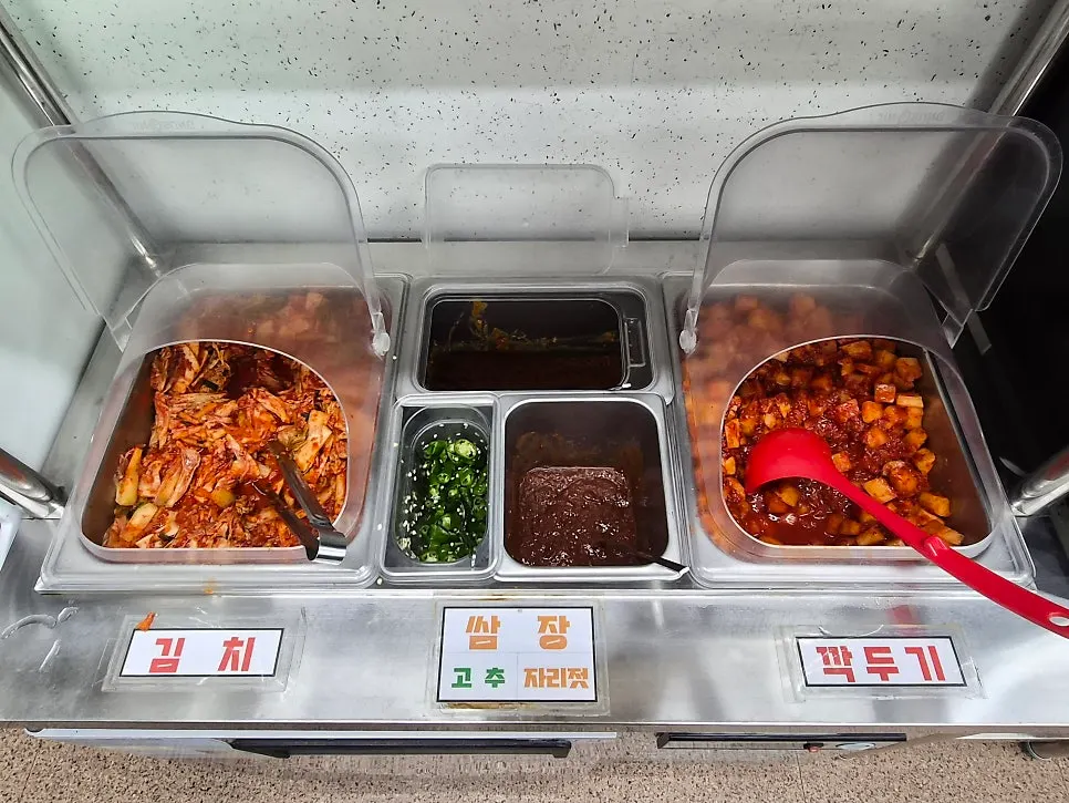 Side dishes and water set out at the self-serve bar