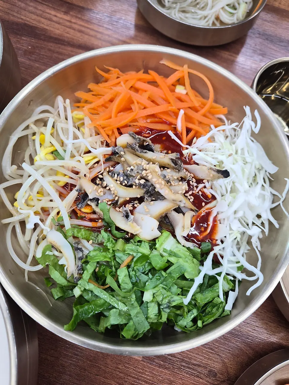 Abalone bibim guksu loaded with vegetables