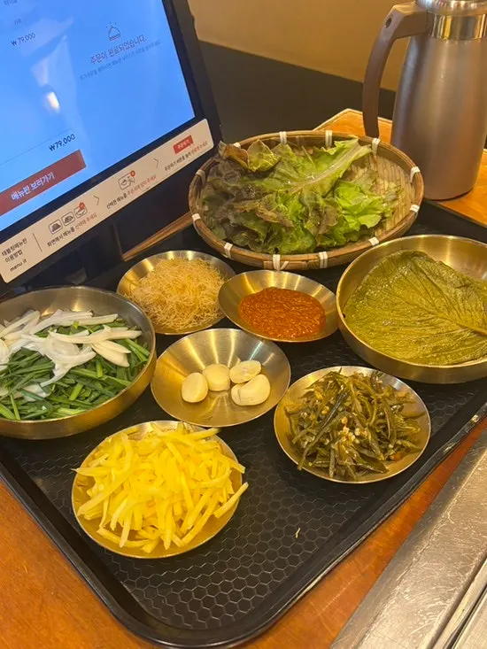 Neatly arranged side dishes served with eel