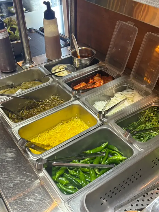 Self-serve bar with side dishes and shredded ginger