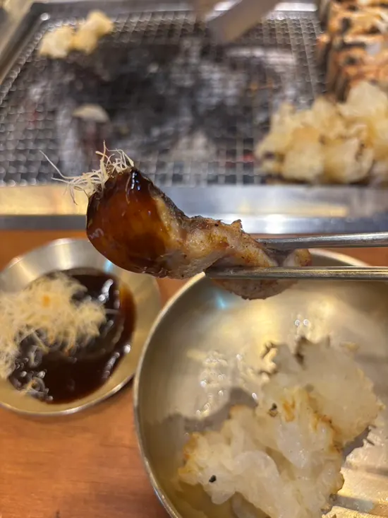 Close-up of golden-brown grilled eel