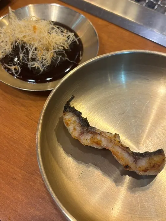A piece of eel dipped in special sauce