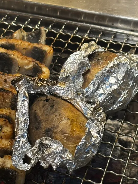 Grilled potato on the grill