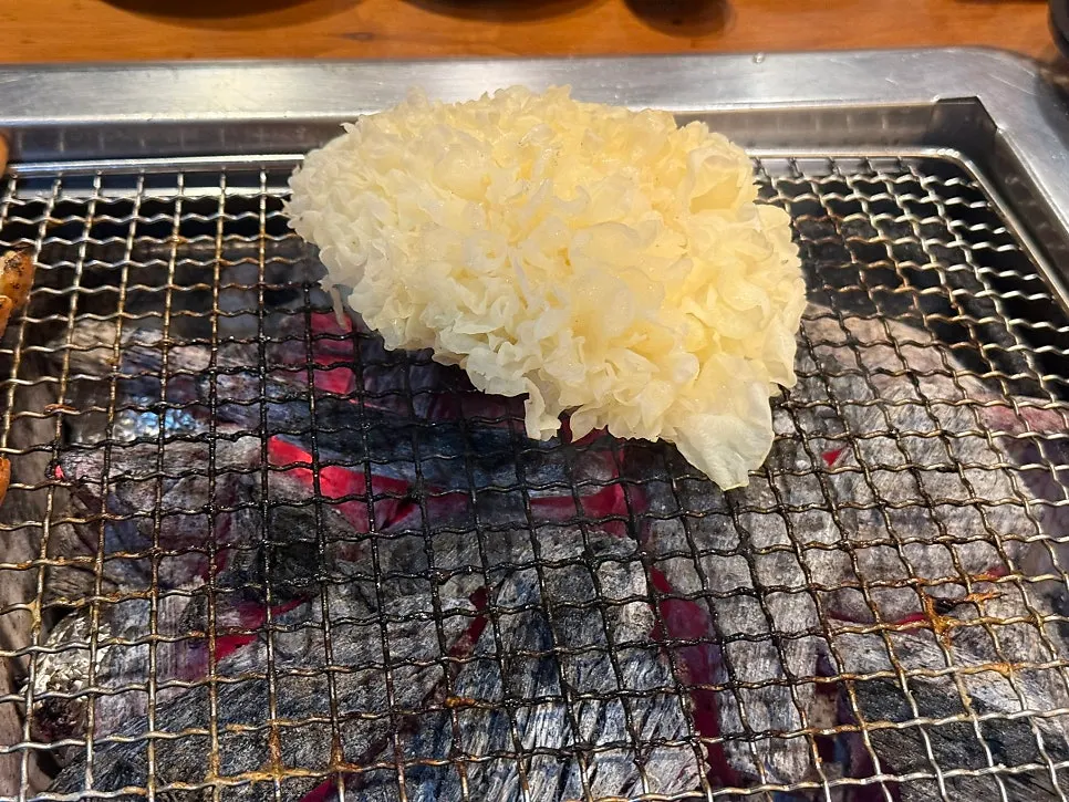 Finished eel moved to the left side of the grill