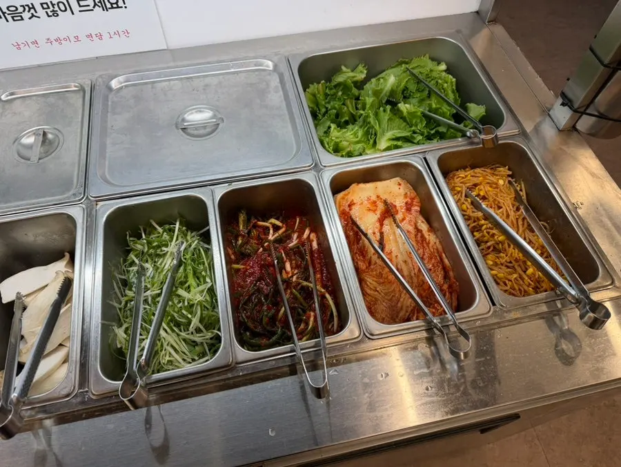 Self-bar stocked with kimchi and bean sprouts