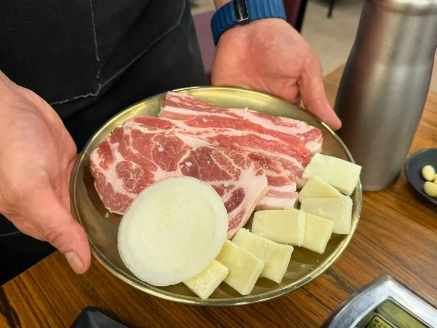 Thick cuts of pork belly, pork neck, and grilled cheese