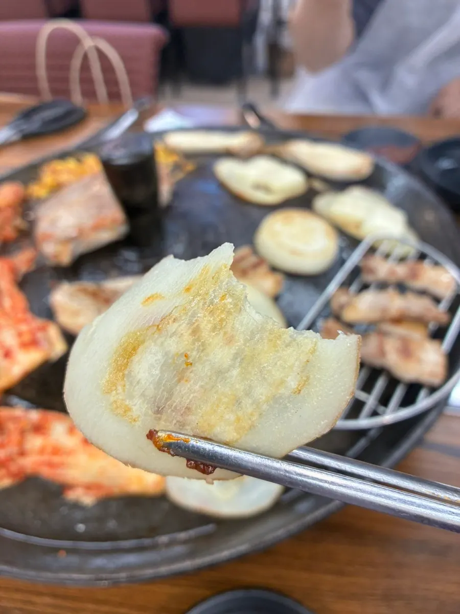 Close-up of golden-brown grilled pork belly