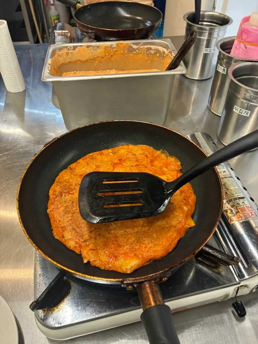 A golden-brown fried kimchi pancake