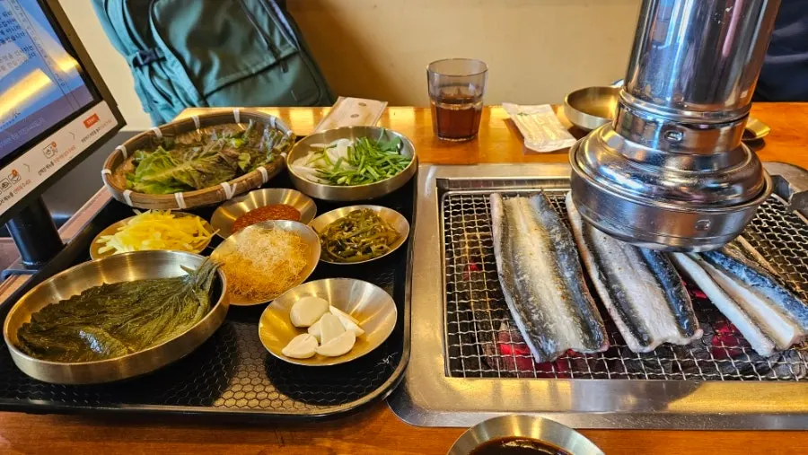 Freshwater eel grilling over charcoal