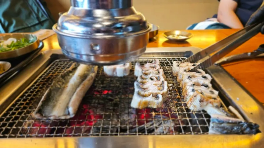 Thick freshwater eel over charcoal