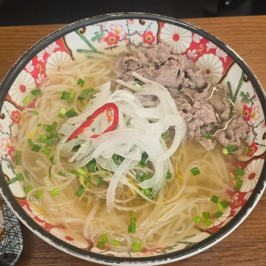 Table setting with shabu pho and demi-glace hireu katsu