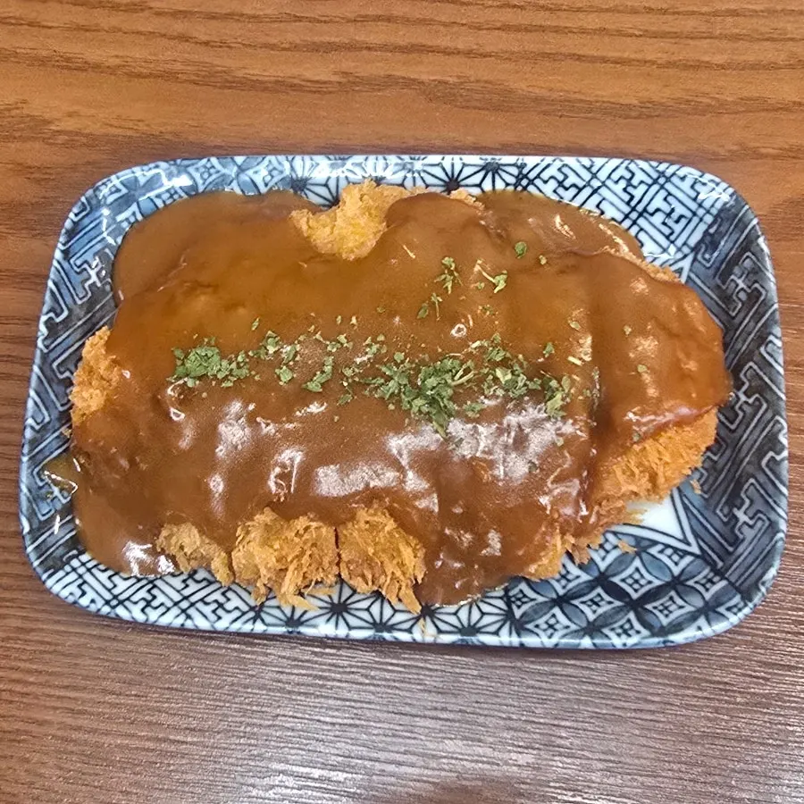Cross-section of a piece of demi-glace hireu katsu