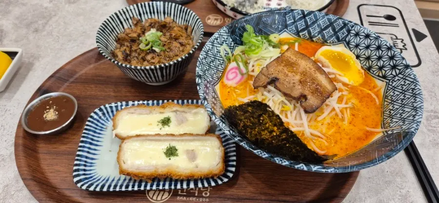Table spread with tonkotsu ramen, buta-don set, and tonkatsu