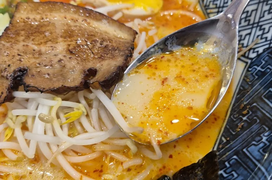 Close-up of thin noodles and bean sprouts in tonkotsu ramen