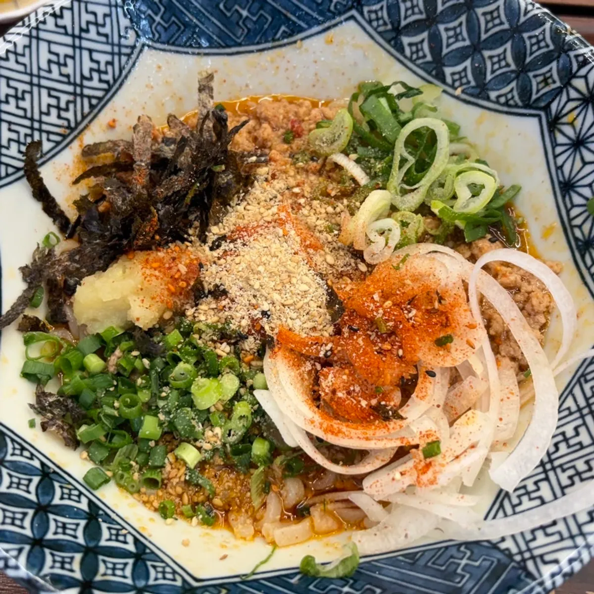 Mazesoba noodles being mixed together