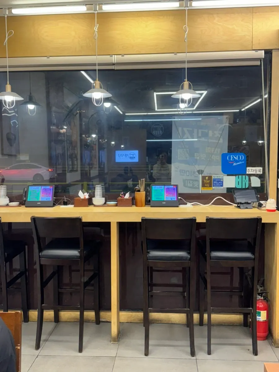 Poster announcing new menu items at Myeonsikdang