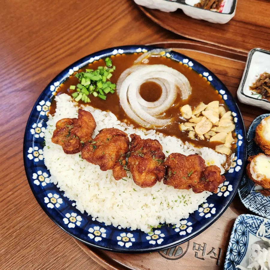 Curry rice bowl topped with karaage fried chicken