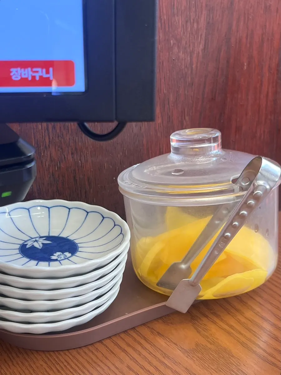 Pickled radish and side dishes set on the table
