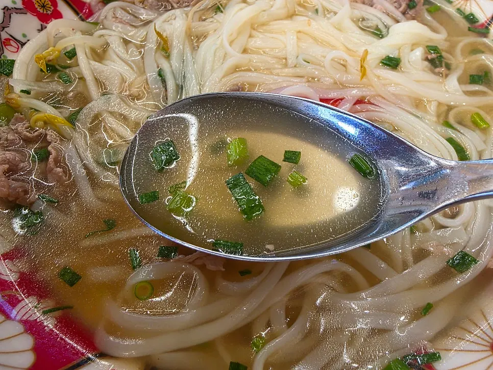 Shabu pho broth with meat fat floating on top