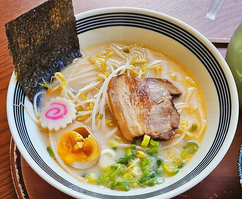 Close-up of tonkotsu ramen topped with garnishes
