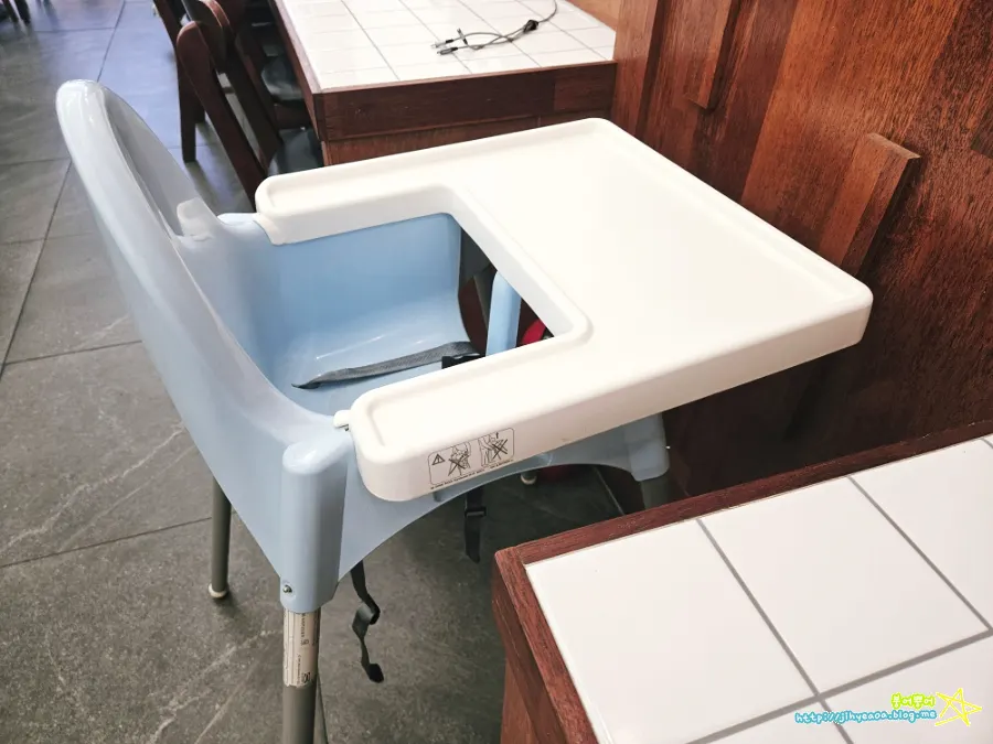 Three people seated at the counter seating